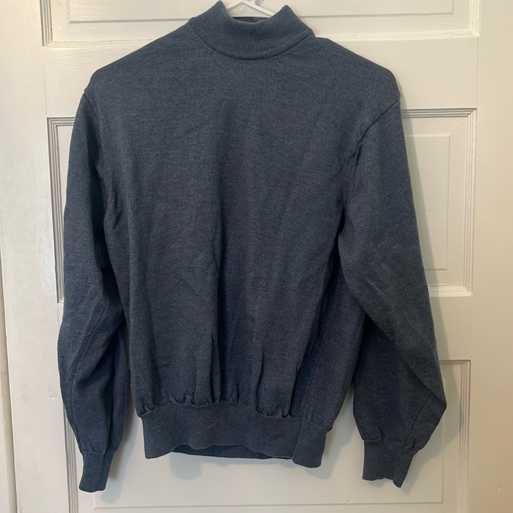 Jos A. Bank 100% wool blue sweater in women’s size M. Has a mock neck detail